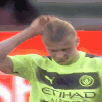 Man In Yellow Etihad Shirt Holds Head GIF
