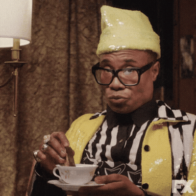 Man In Yellow Hat And Glasses Holding Coffee GIF