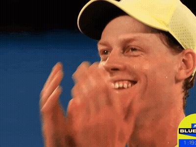 Man In Yellow Hat Applauds Sign Saying Blue GIF