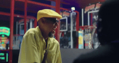 Man In Yellow Hat Talking To Man GIF