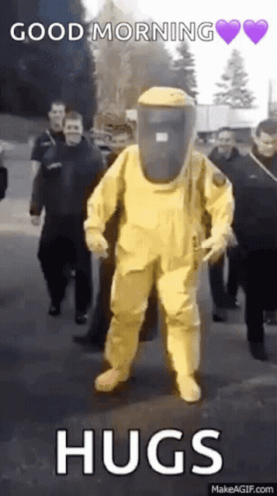 Man In Yellow Hazmat Suit Walking GIF