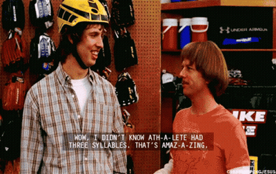 Man In Yellow Helmet Talking To Another Man GIF