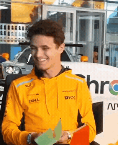 Man In Yellow Hoodie Holding Paper GIF