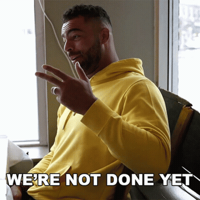 Man In Yellow Hoodie Says We're Not Done Yet GIF