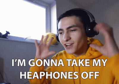 Man In Yellow Hoodie Taking Off Headphones GIF