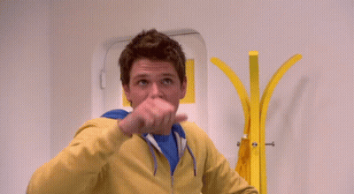 Man In Yellow Jacket And Blue Shirt GIF