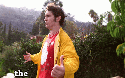Man In Yellow Jacket Giving Thumbs Up GIF