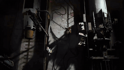 Man In Yellow Jacket In Dark Room With Light GIF