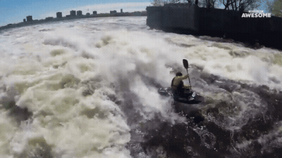 Man In Yellow Jacket Kayaking Saying Awesome GIF