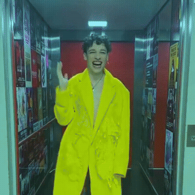 Man In Yellow Jacket Laughing GIF