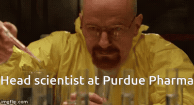 Man In Yellow Jacket Pouring Liquid Into Beaker Head Scientist At Purdue Pharma GIF