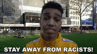 Man In Yellow Jacket Says Stay Away From Racists GIF