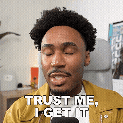 Man In Yellow Jacket Says Trust Me I Get It Into Microphone GIF