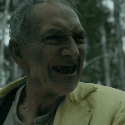 Man In Yellow Jacket Smiling With Mouth Open GIF