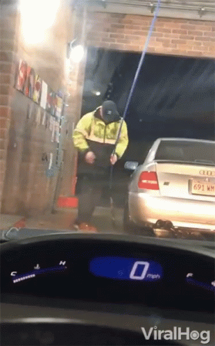 Man In Yellow Jacket Washing Car, Speedometer 0 Mph GIF