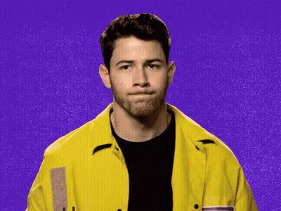 Man In Yellow Jacket Waving GIF