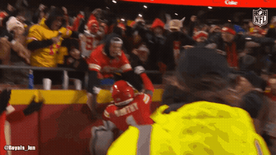 Man In Yellow Jacket With Number 1 GIF