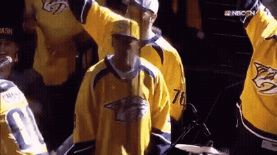 Man In Yellow Jersey 76 At Microphone GIF