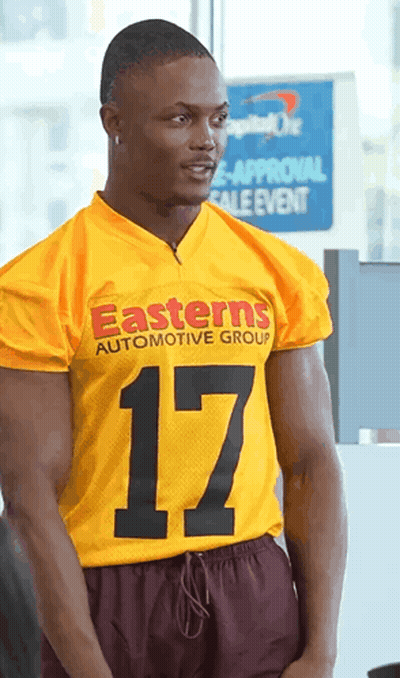Man In Yellow Jersey Saying Easterns Automotive Group GIF