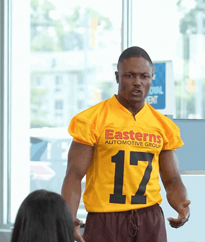 Man In Yellow Jersey Saying Easterns Automotive Group GIF