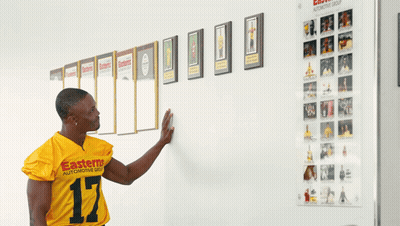 Man In Yellow Jersey Saying Easterns Automotive Group GIF