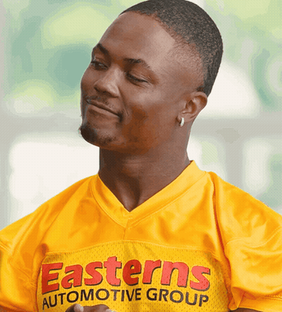 Man In Yellow Jersey Saying Easterns Automotive Group GIF