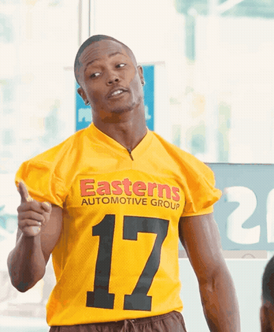 Man In Yellow Jersey Saying Easterns Automotive Group GIF
