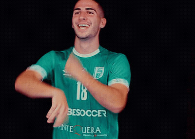 Man In Yellow Jersey Surrounded By People GIF