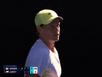 Man In Yellow Nike Hat Looking At Scoreboard GIF