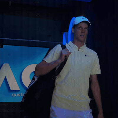 Man In Yellow Nike Shirt Carrying Bag GIF