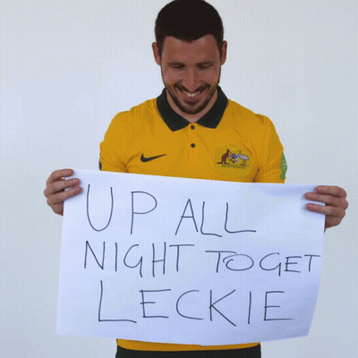 Man In Yellow Nike Shirt Holding Sign Up All Night To Get Leckie GIF