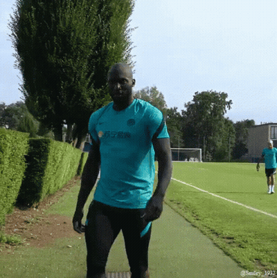 Man In Yellow Nike Vest At Door GIF