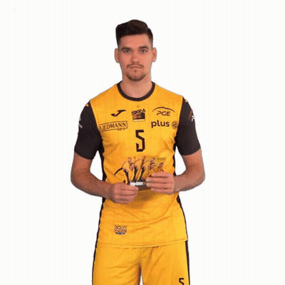 Man In Yellow PGE Jersey Holding Cards GIF