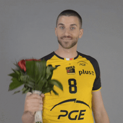 Man In Yellow PGE Shirt Holding Red Roses GIF