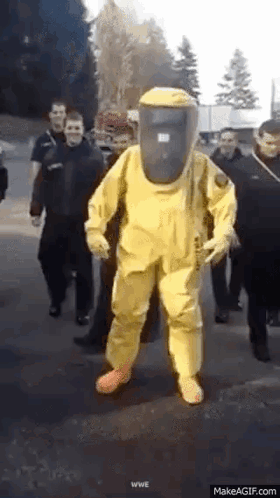 Man In Yellow Protective Suit Walking GIF