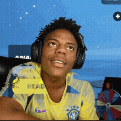 Man In Yellow Read Shirt With Headphones GIF