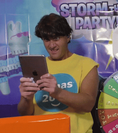 Man In Yellow Shirt 20 Looking At Tablet GIF
