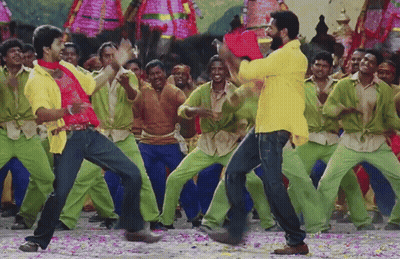 Man In Yellow Shirt Dancing Before Green Pants Crowd GIF