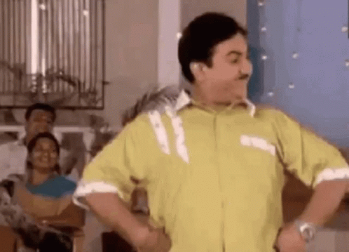Man In Yellow Shirt Dancing Hands On Hips GIF