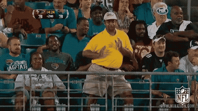 Man In Yellow Shirt Dancing In Stands GIF