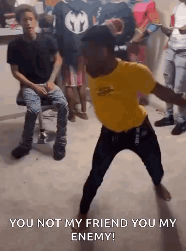 Man In Yellow Shirt Dancing Saying You Not My Friend You My Enemy GIF