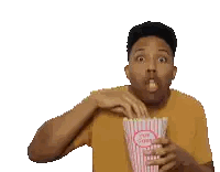 Man In Yellow Shirt Eating Popcorn From Striped Bag Sticker
