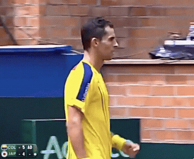 Man In Yellow Shirt Facing Col 5 Ad GIF
