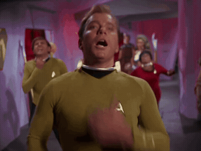Man In Yellow Shirt Hand Over Mouth GIF