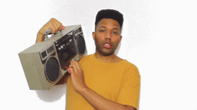 Man In Yellow Shirt Holding Boombox GIF