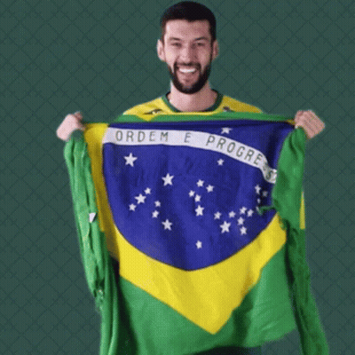 Man In Yellow Shirt Holding Brazilian Flag GIF