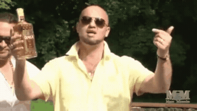 Man In Yellow Shirt Holding Duca Tequila GIF