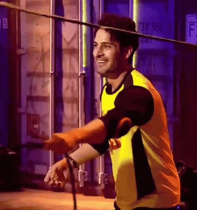 Man In Yellow Shirt Holding Rope GIF