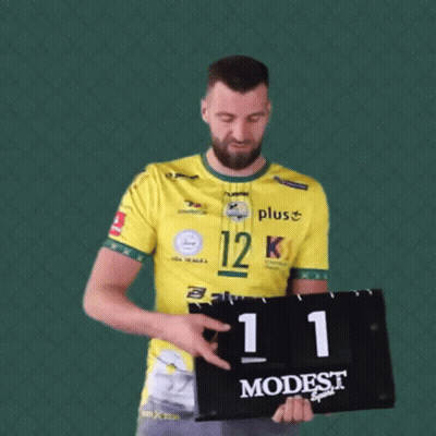 Man In Yellow Shirt Holding Scoreboard 21 GIF