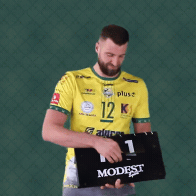 Man In Yellow Shirt Holding Scoreboard Saying Modest GIF